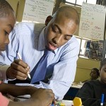 A Teach for America teacher works with students in the classroom
