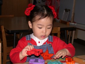 little girl with toys