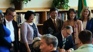 Governor Jay Inslee signs Opportunity Gap House Bill 1541 into law, with (l-r) Rep. Lillian Ortiz-Self, Rep. Sharon Tomiko Santos and Rep. Tina Orwall