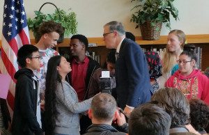 Governor Jay Inslee congratulates Aki Kurose Middle School students after he signed Opportunity Gap HB 1541